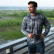 Load image into Gallery viewer, Action Shot on Porch - Hydrotech Long Sleeve Performance Fishing Shirt - Overcast Camo - UPF 50+ Sun Protection - Men&#39;s Moisture Wicking Quick Dry T Shirt - Sportsman Gear
